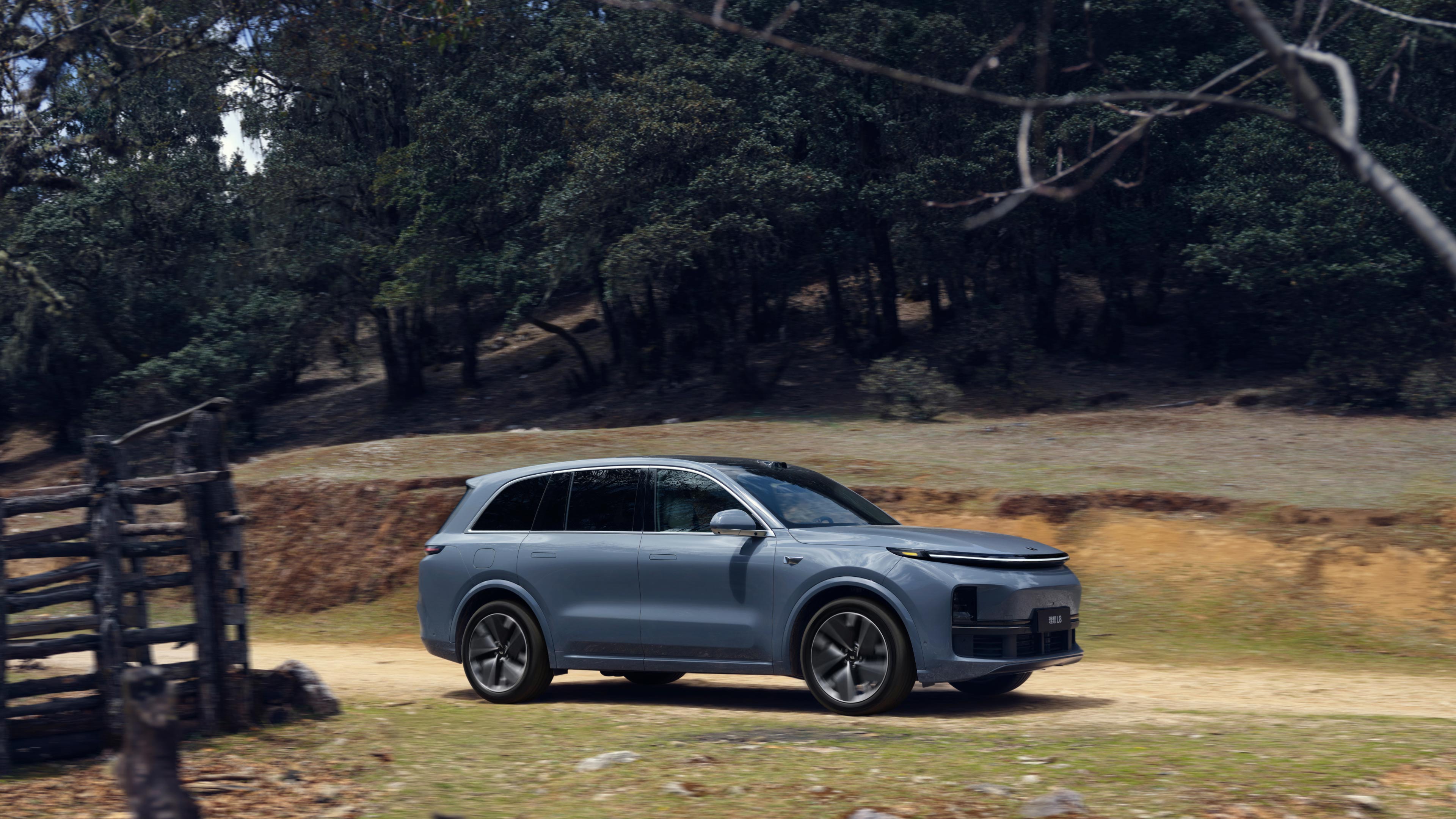 Official Li Auto product image of a Li L8 SUV driving through a misty landscape